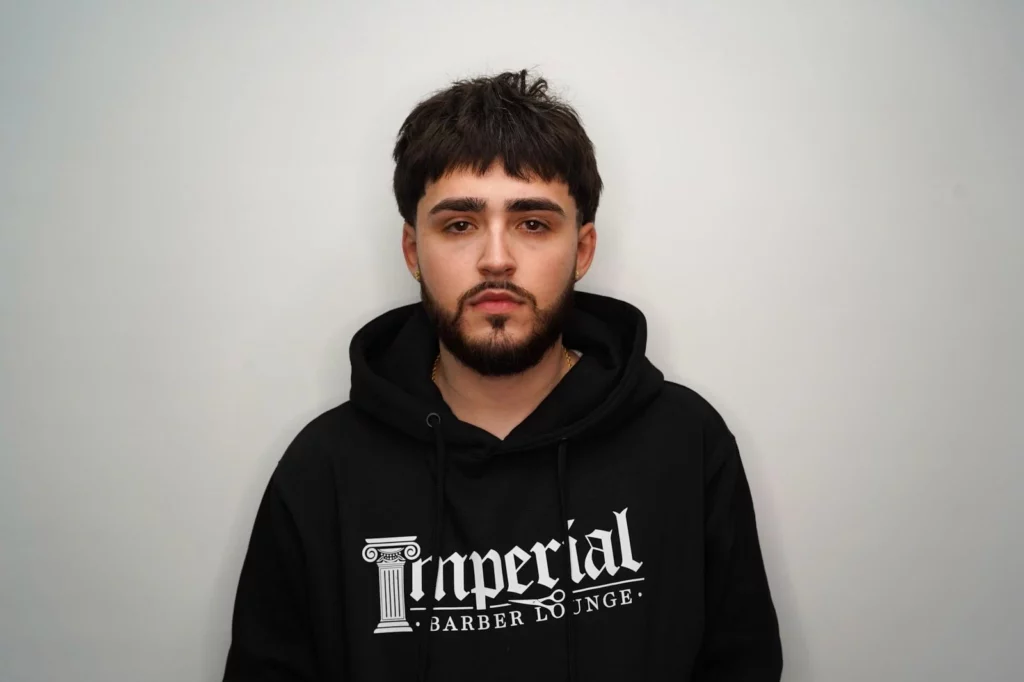 Headshot of Caleb Parker, co-owner of Imperial Barber Lounge
